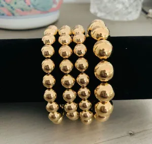 Four Gold Bead Bracelets